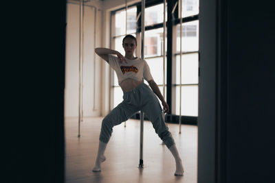 Low section of woman walking on floor