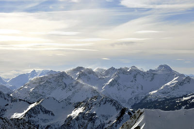 Scenic view of snowcapped mountains against sky