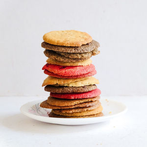 Close-up of cookies on table against white background