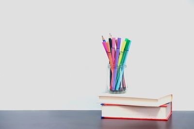 Close-up of multi colored pencils on table