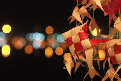 Defocused image of illuminated christmas tree at night