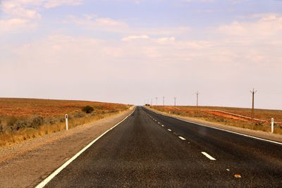 Empty road against sky