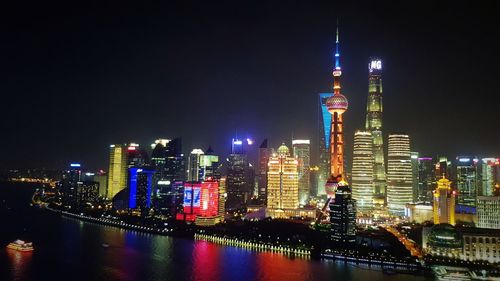 Illuminated buildings in city at night