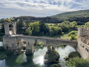 Bridge over river against sky