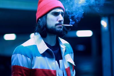 Portrait of young man smoking