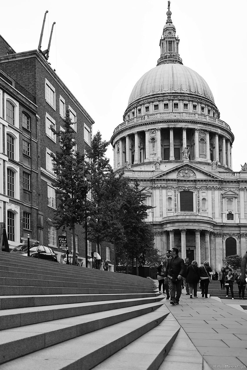 PEOPLE AT CATHEDRAL AGAINST CLEAR SKY