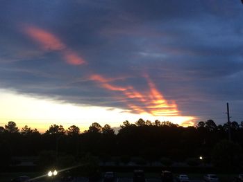 Silhouette trees against sky during sunset