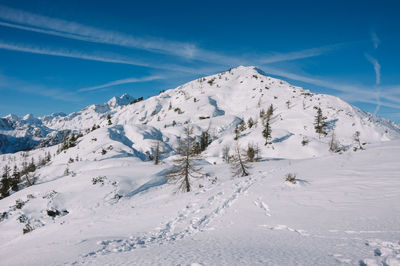 Scenic view of snowcapped mountains against sky