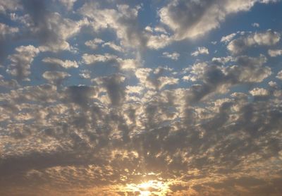 Low angle view of clouds in sky during sunset