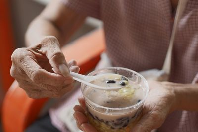 Close-up of man drinking glass