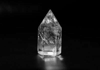 Close-up of crystal stone against black background