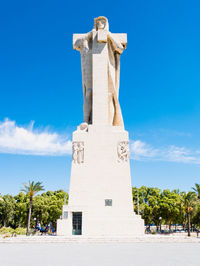 View of statue against blue sky