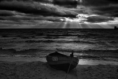 Boat on beach against sky