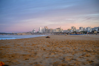 Scenic view of beach against sky during sunrise in portimao