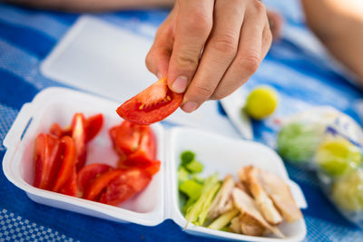 Close-up of hand holding food