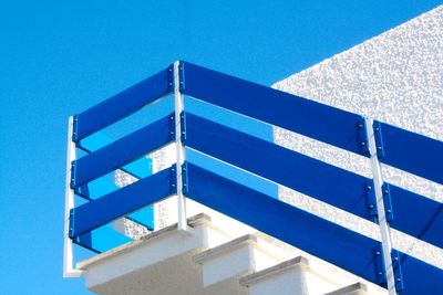 Low angle view of building against clear blue sky