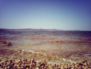 Scenic view of sea against clear sky