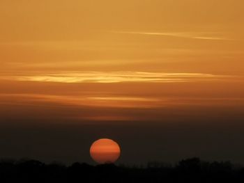 Scenic view of silhouette landscape against romantic sky at sunset