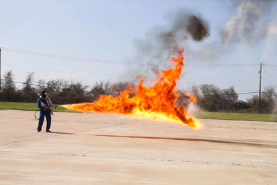 Full length of man standing on fire