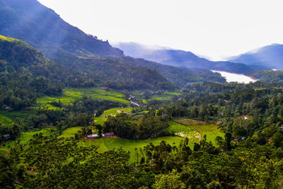 Scenic view of landscape and mountains against sky