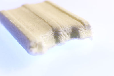 Close-up of ice cream over white background