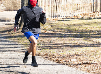 Rear view of man running