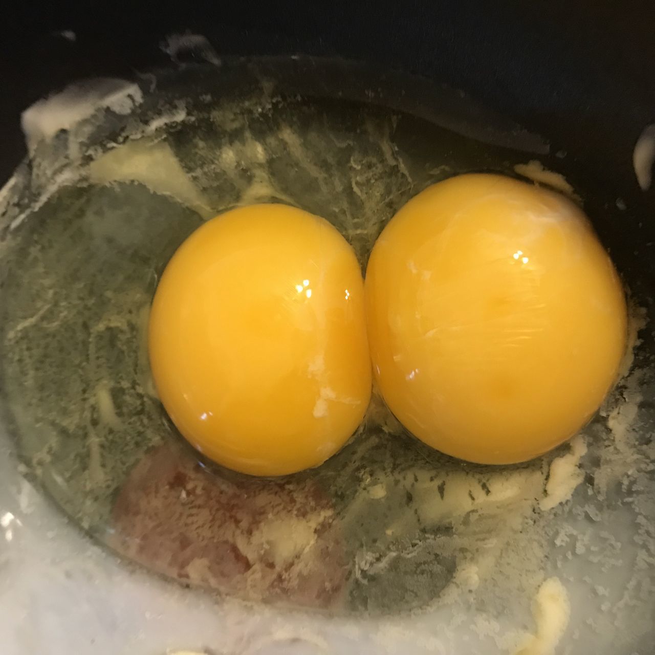 HIGH ANGLE VIEW OF YELLOW EGGS IN KITCHEN