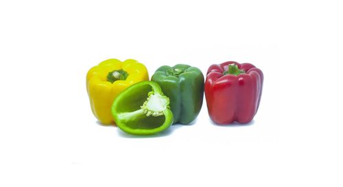 Close-up of bell peppers against white background