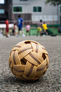 Close-up of wicker ball on street