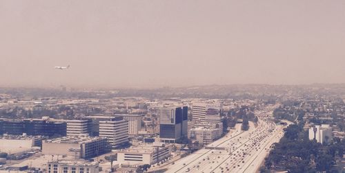 Aerial view of cityscape against sky