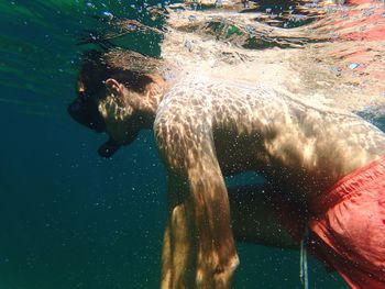 Man swimming in sea