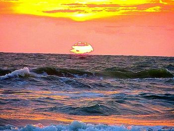 Scenic view of sea at sunset