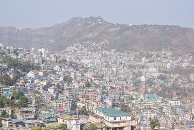 Aerial view of cityscape against sky