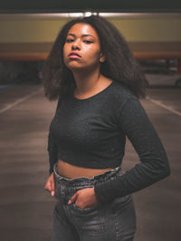 Portrait of beautiful young woman looking away