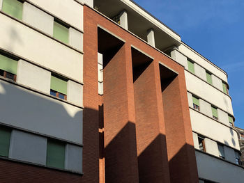 Low angle view of building against sky on sunny day