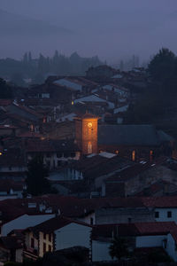 High angle view of city lit up at dusk