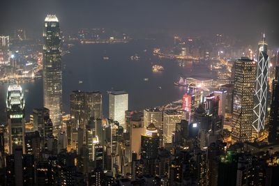 Aerial view of illuminated buildings in city at night