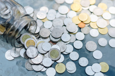 High angle view of coins on table