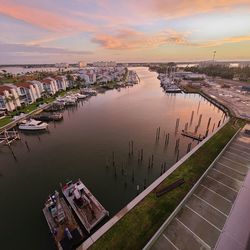 High angle view of city by sea against sky