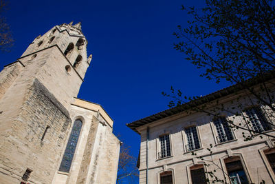 Low angle view of building against clear blue sky