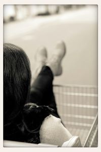 Close-up of woman standing on tiled floor