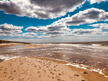 Scenic view of beach against sky