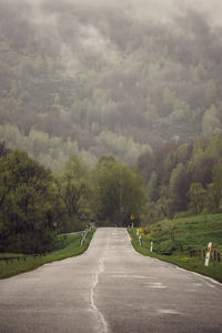 Empty road along landscape