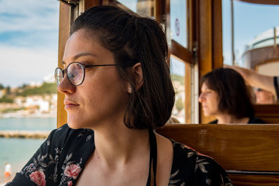 Portrait of young woman looking away