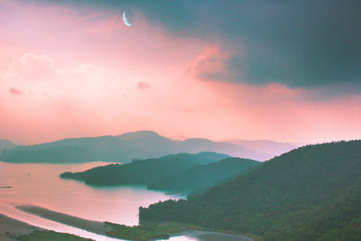 Scenic view of mountains against sky during sunset