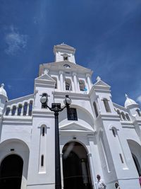 Low angle view of building against blue sky