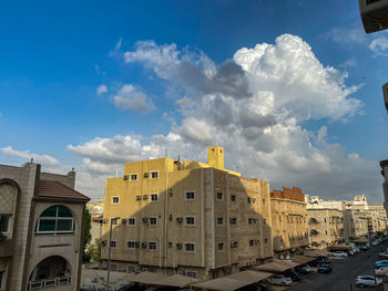 Low angle view of buildings against sky in city