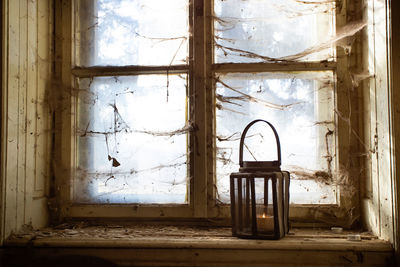 Abandoned building seen through window