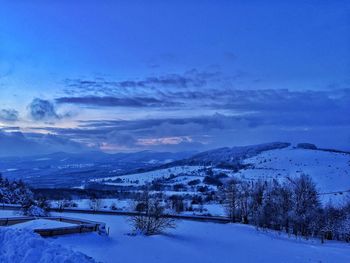 Scenic view of snow covered mountain against sky