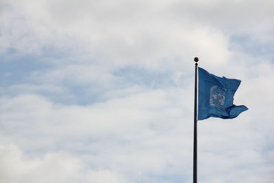 United nations flag waving against sky